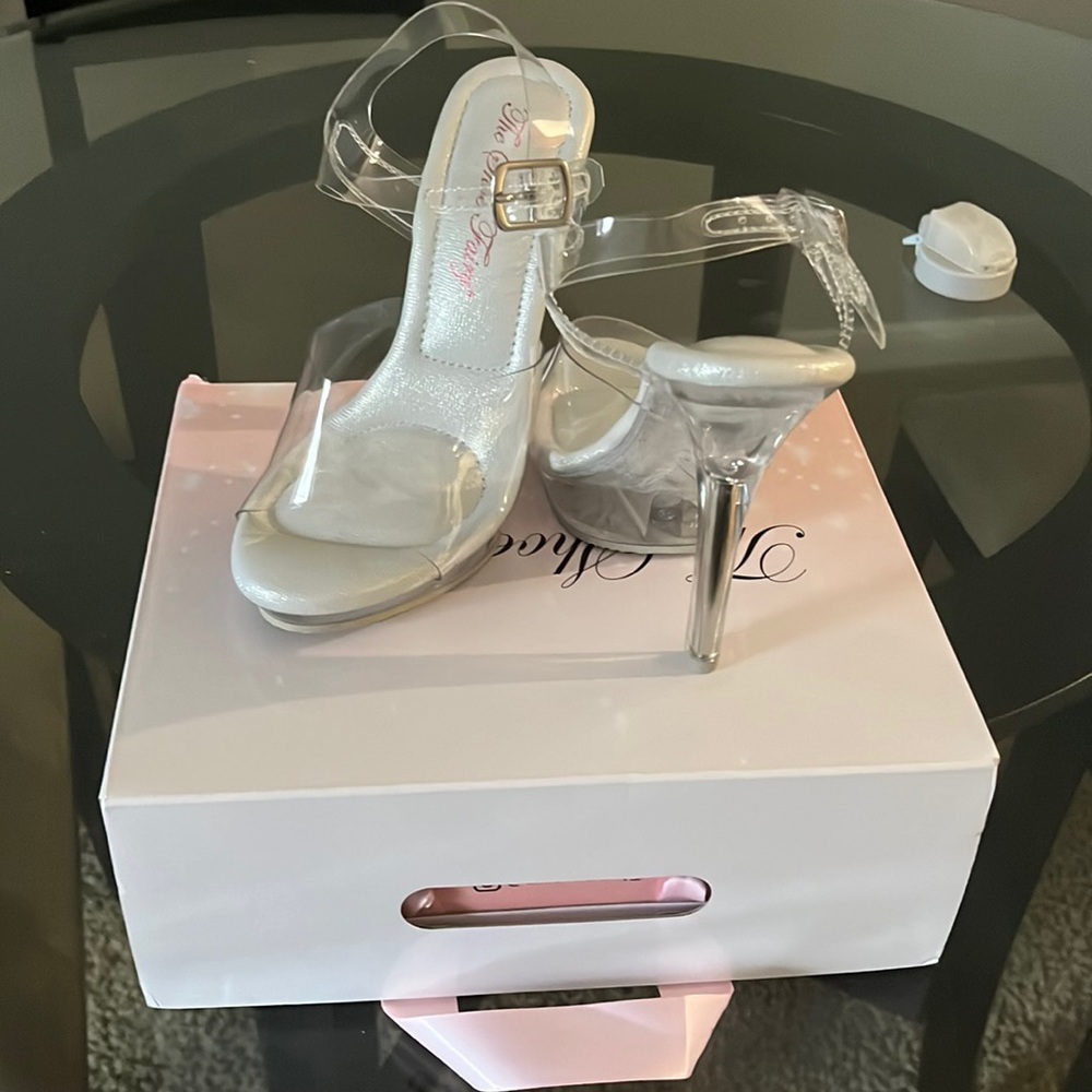 Brand new!! Tried practicing in them once and I simply couldn’t walk in them.